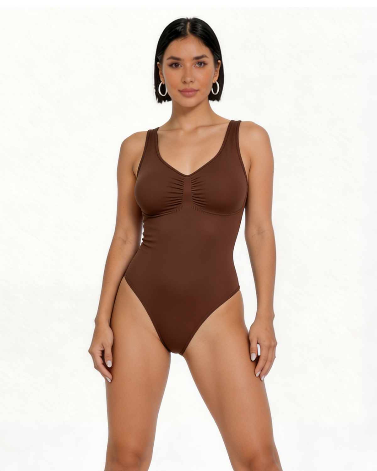 Woman wearing a brown one-piece swimsuit on a white background