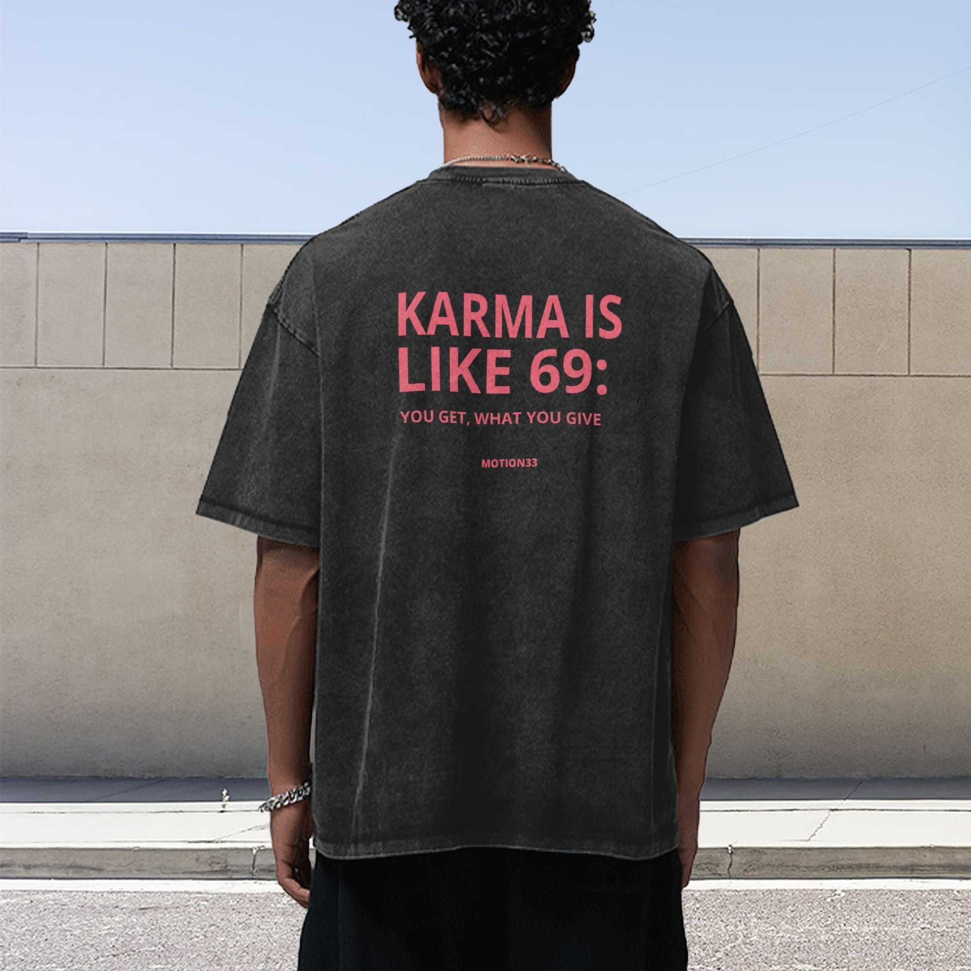 Karma Is Like 69 oversized black tee, model back
